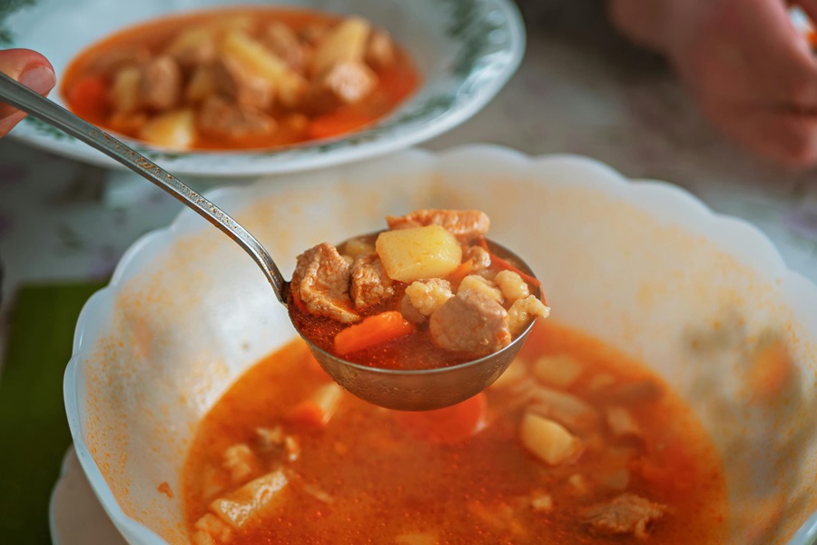 Crockpot Mexican Soup Recipes a Person Serving Themselves Soup with a Ladell