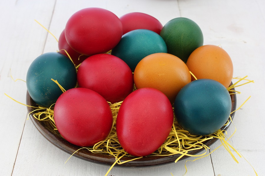 Easy Crockpot Easter Recipes Close Up of a Basket Filled with Colored Easter Eggs