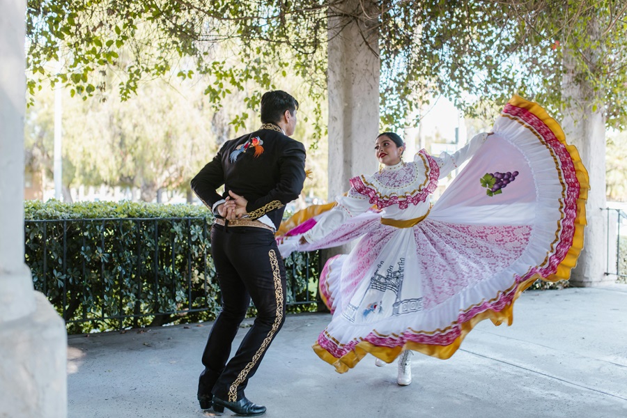 Instant Pot Cinco de Mayo Recipes a Mariachi and a Woman Dancing in Traditional Mexican Clothing