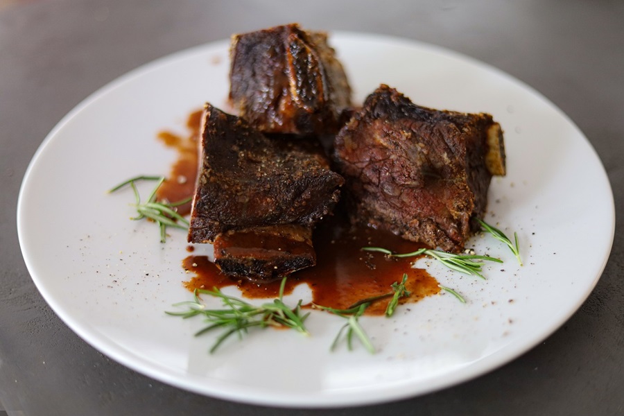 Slow Cooker Short Ribs Recipes Close Up of a Plate of Short Ribs Cooked in a Sauce