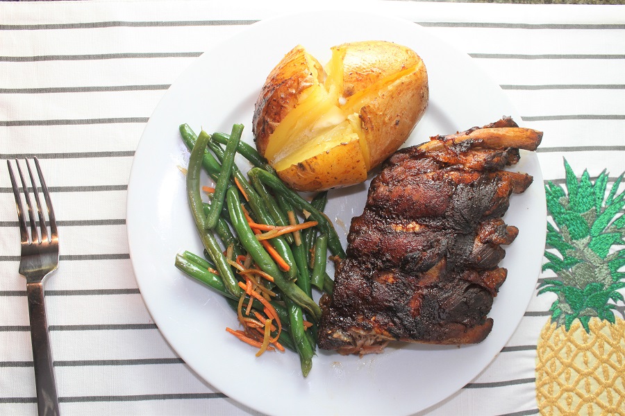 Crockpot Summer Dinner Recipes Overhead View of a Plate of Ribs with a Baked Potato and some Green Beans