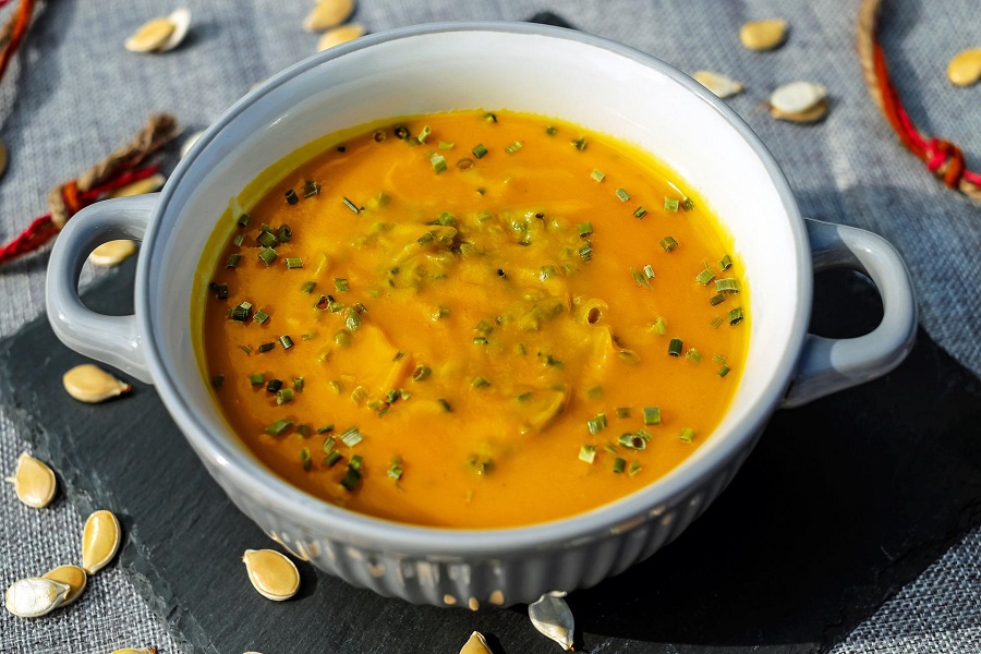 Instant Pot Blender Soup Recipes Close Up of a Bowl of Soup Topped with Herbs 