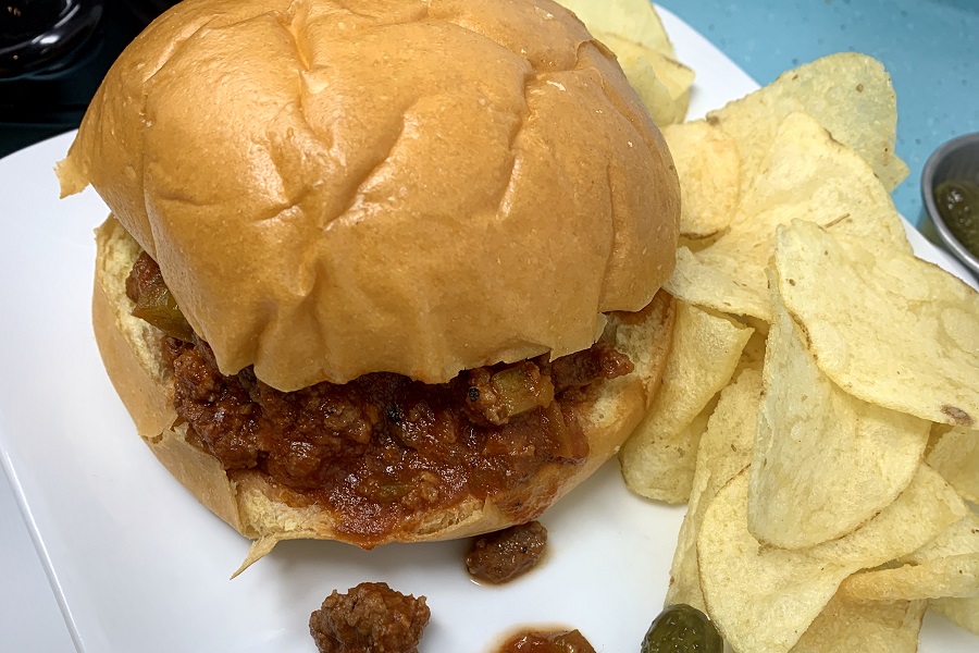 Crockpot Summer Dinner Recipes Close Up of a Sloppy Joe on a Plate with Some Chips