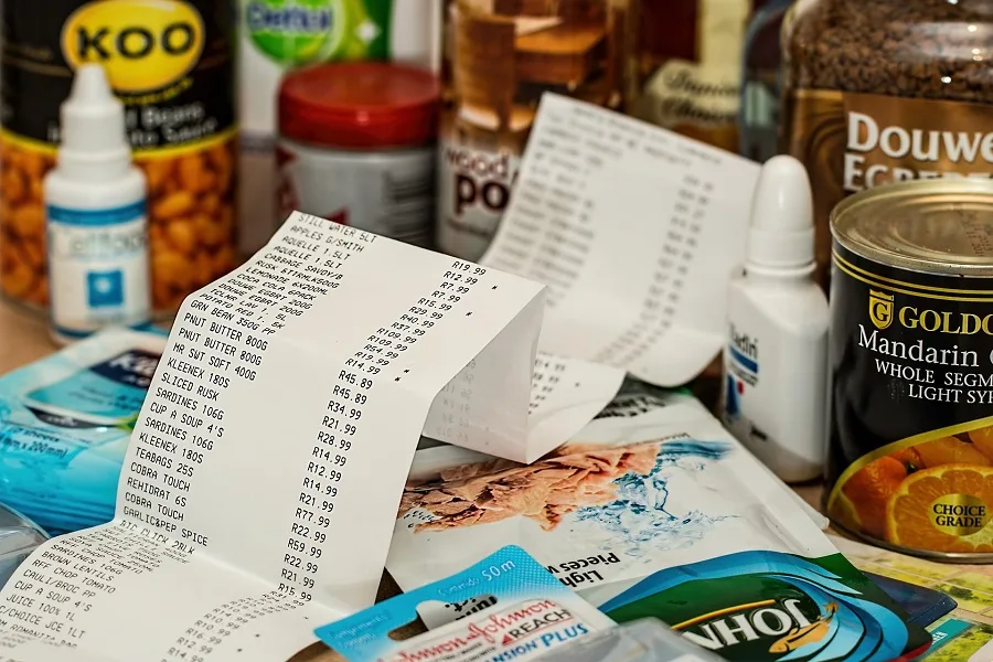 Healthy Crockpot Meals on a Budget a Long Receipt Surrounded by Groceries