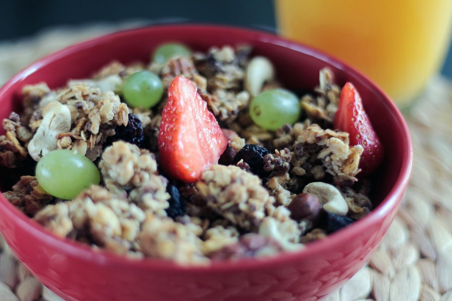 Healthy Crockpot Snack Recipes a Bowl of Granola with Strawberries and Grapes