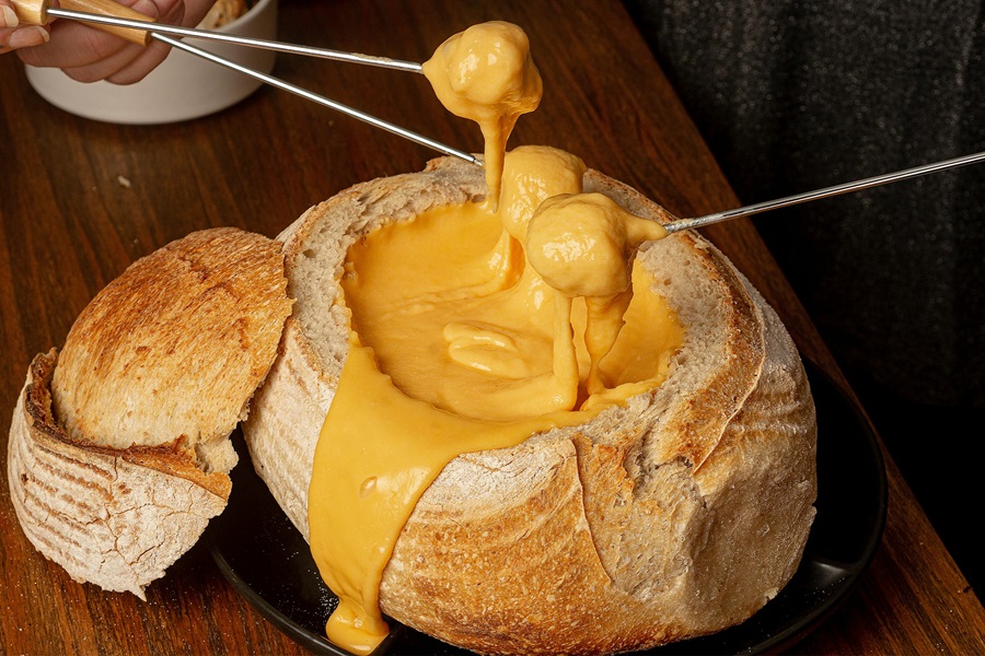 Healthy Crockpot Snack Recipes Close Up of a Bread Bowl Filled with Cheese Dip