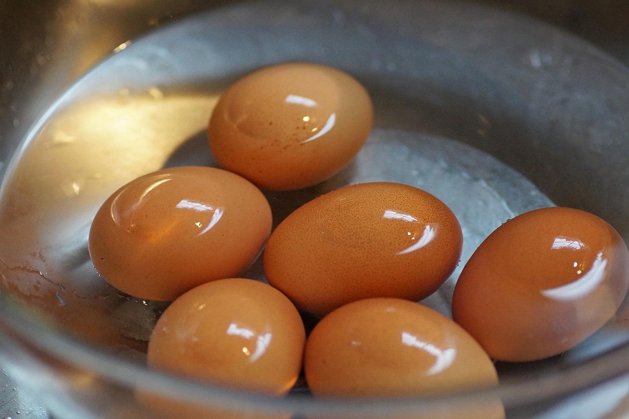 How to Make Instant Pot Hard Boiled Eggs Close Up of Eggs in a Pot Filled with Water