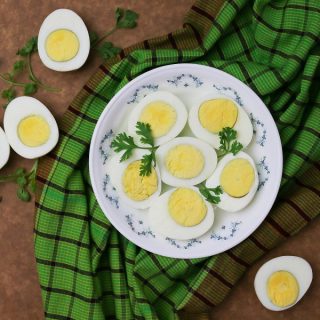 How to Make Instant Pot Hard Boiled Eggs Overhead View of a Platter of Hard Boiled Eggs Cut in Half