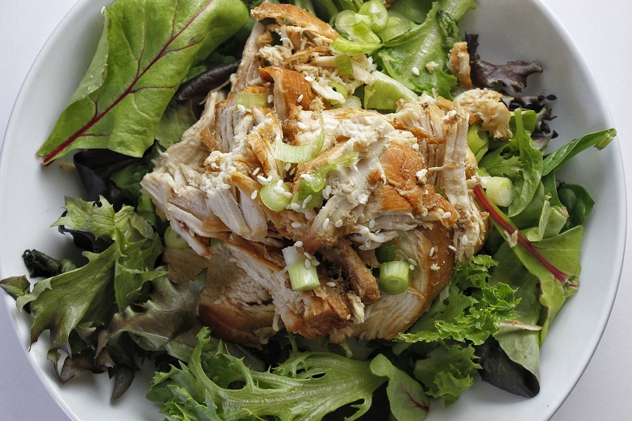 How to Make Instant Pot Shredded Chicken Close Up of a Bowl of Salad Topped with Teriyaki Chicken