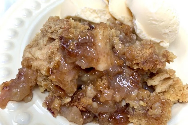 Fall Crockpot Recipes Close Up of a Serving of Apple Crisp with Vanilla Ice Cream