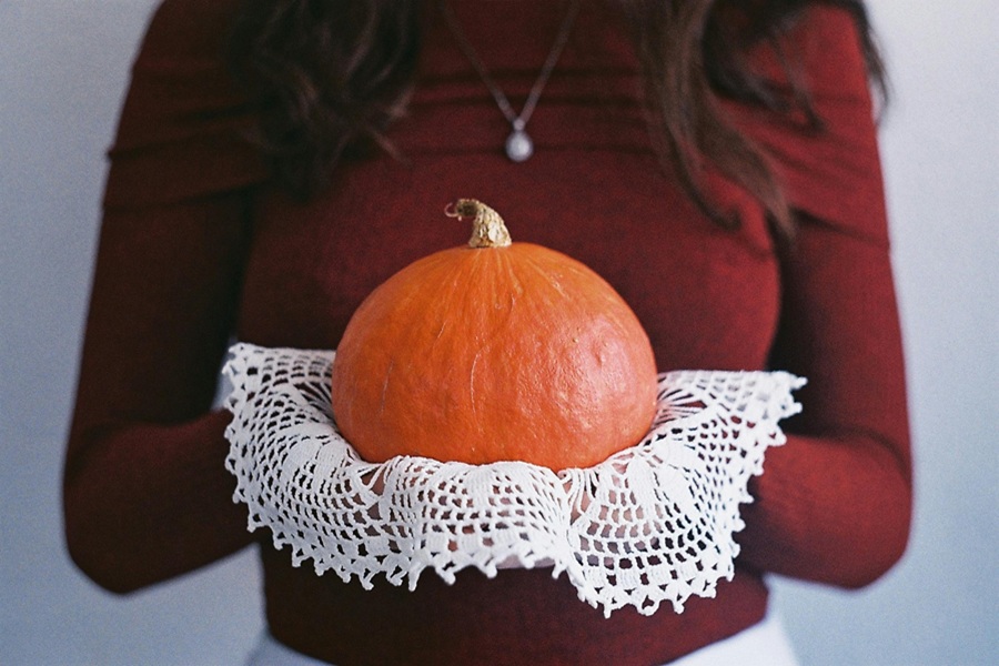 Slow Cooker Pumpkin Bread Recipes Close Up of a Woman Holding a Pumpkin