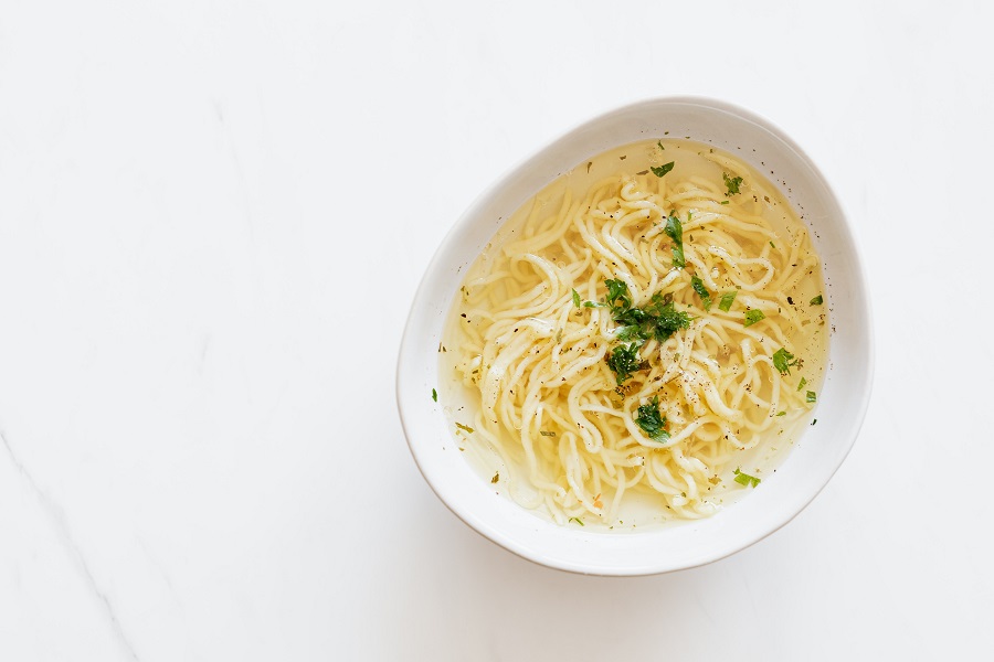 How to Make Instant Pot Chicken Noodle Soup Overhead of a Curved Bowl of Chicken Noodle Soup