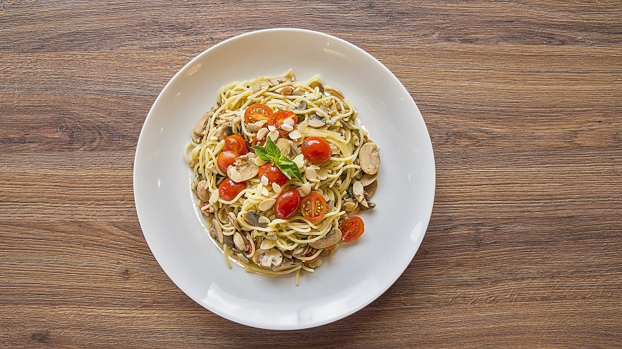 Instant Pot Chicken Pasta Recipes Overhead View of a Plate of Pasta with Tomatoes, Chicken, and Basil