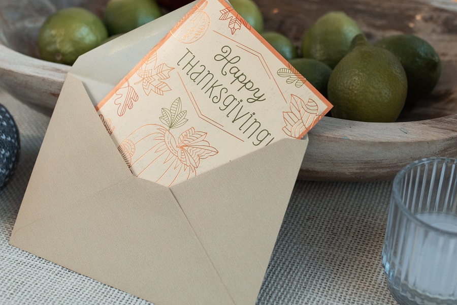 Instant Pot Thanksgiving Appetizers a Note Card Sticking Out of an Envelope That Says Happy Thanksgiving