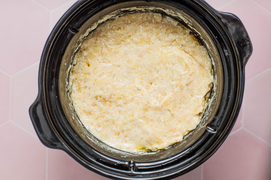 Crockpot Hashbrown Casserole Recipe Ingredients Mixed Together in a Crockpot