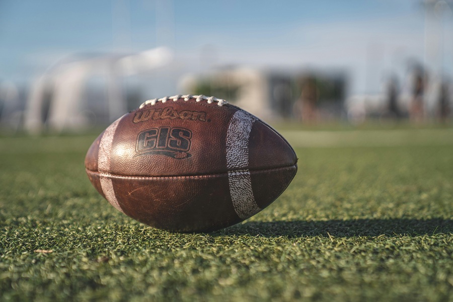 Super Bowl Appetizers Close Up of a Football on a Grass Field