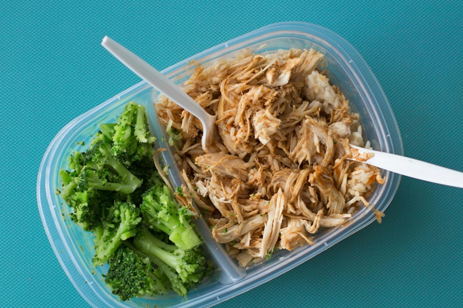 Instant Pot Frozen Chicken Recipes Close Up of Shredded Chicken and Broccoli in a Meal Prep Container