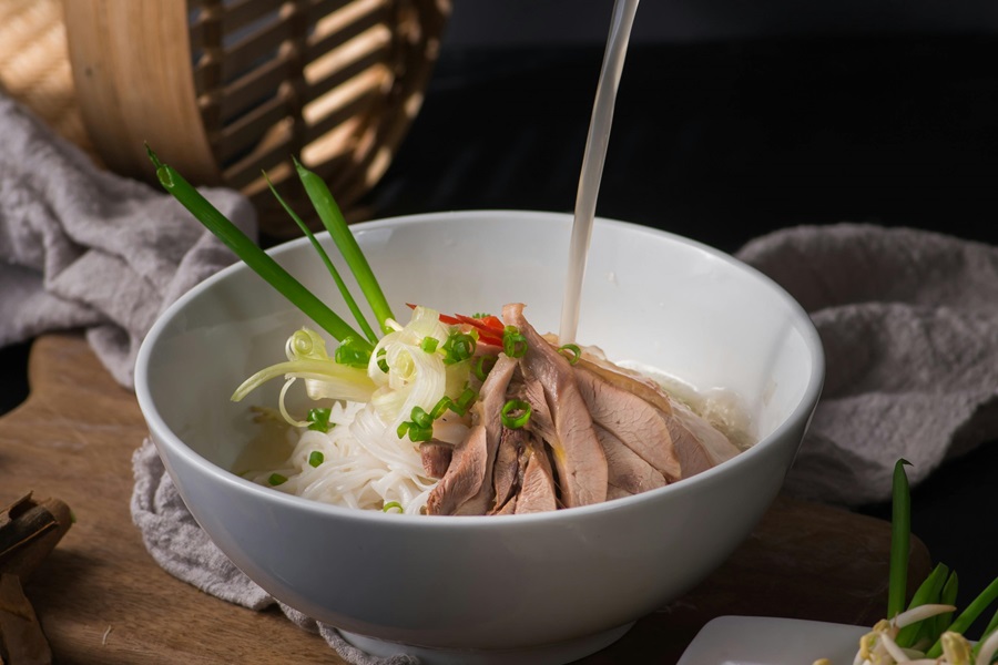 Instant Pot Frozen Chicken Recipes a Bowl of Chicken Pho with Broth Pouring in