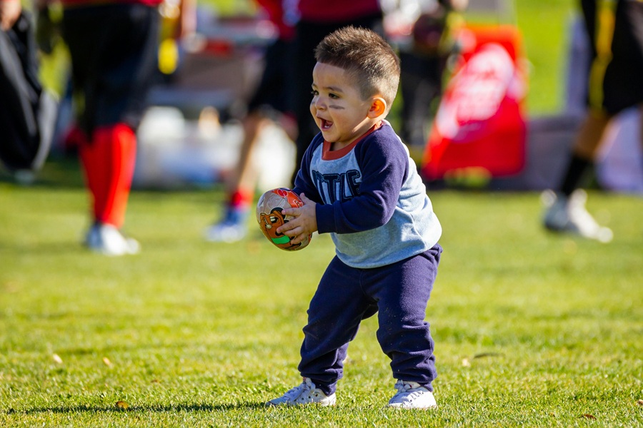 Super Bowl Appetizers a Little Boy Holding a Football on a Field