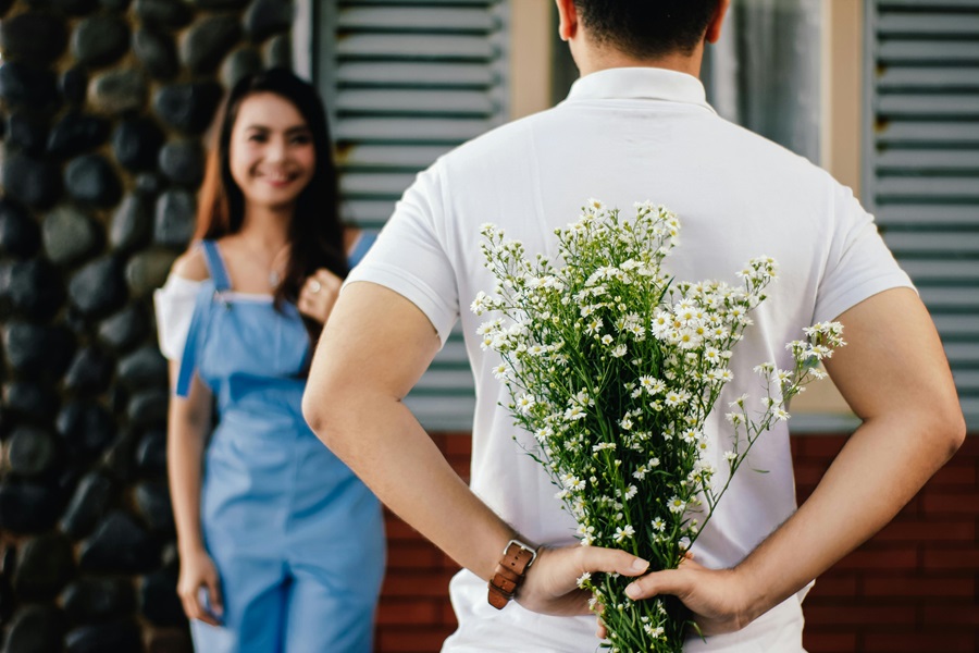 Romantic Instant Pot Recipes for Two a man Standing in Front of a Woman While Holding Flowers Behind His back