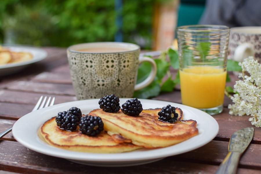 Slow Cooker Brunch Recipes a Plate of Pancakes with Blueberries and a Mimosa