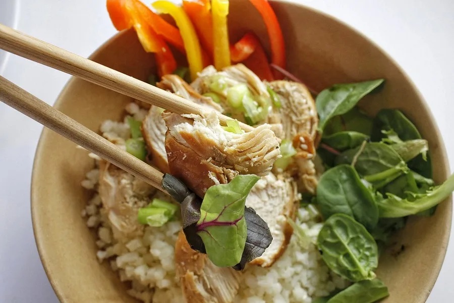 Valentines Day Dinner Instant Pot Recipes Close Up of a Bowl of Teriyaki Chicken on Top of Salad