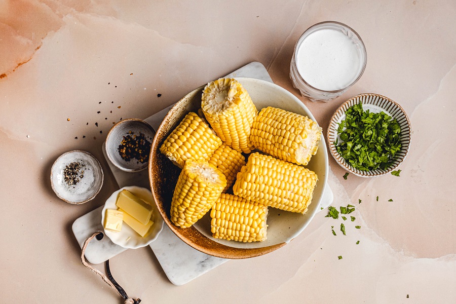 Crockpot Corn on the Cob with Coconut Milk Recipe Overhead View of the Ingredients Separated and Laid Out on a Counter Top