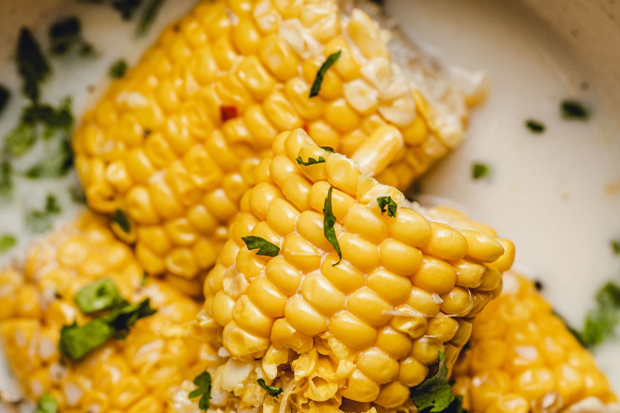 Crockpot Corn on the Cob with Coconut Milk Recipe Close Up of Cooked Corn on the Cob Halves