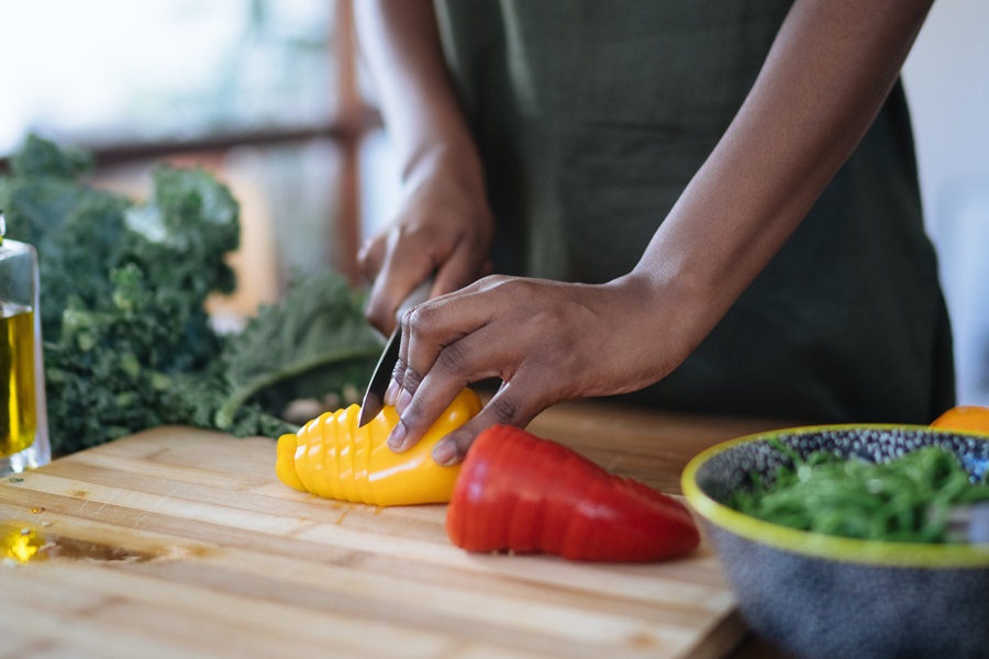 Instant Pot Meal Prep Recipes for Spring Close Up of a Person Slicing Veggies on a Cutting Board