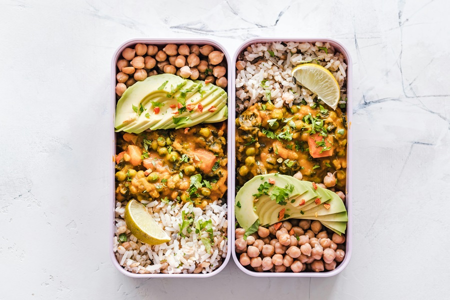 Instant Pot Meal Prep Recipes for Spring Overhead View of Two Meal Prep Containers Filled with Mexican Food