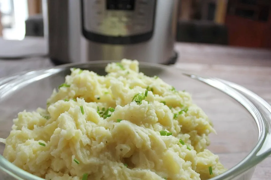 I Love my Instant Pot Memes Close Up of a Bowl of Mashed Potatoes with an Instant Pot Blurred in the Background