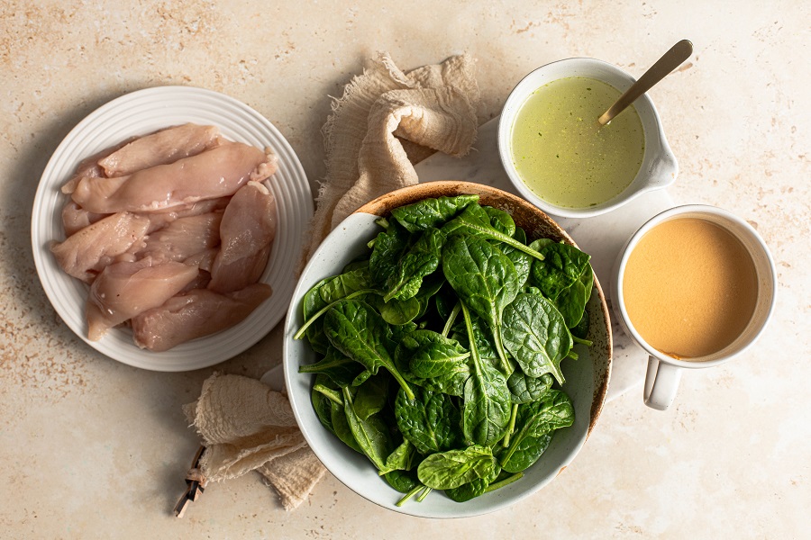 Slow Cooker Chicken and Spinach Rice Bowl Recipe Overhead View of the Ingredients on a Wooden Surface