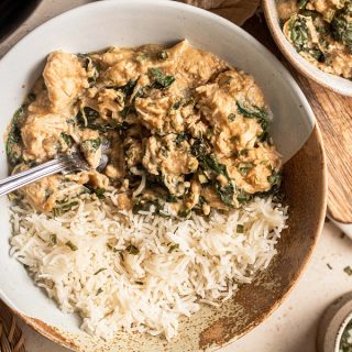 Slow Cooker Chicken and Spinach Rice Bowl Recipe Overhead View of a Bowl of Spinach Chicken with Jasmine Rice and a Fork