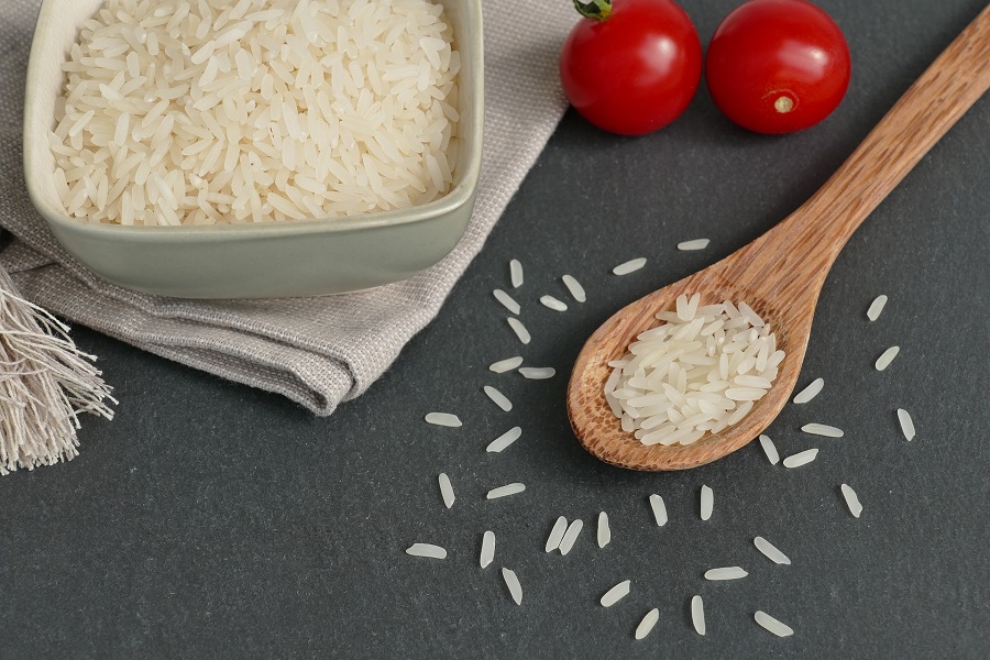 Crockpot Pepper Steak Recipes Overhead View of a Small Bowl of Rice with a Wooden Spoon