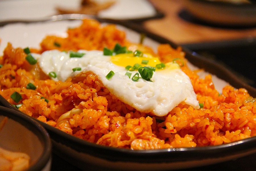 Instant Pot Rice Recipes Close Up of a Plate of Mexican Rice with an Over Easy Egg On Top
