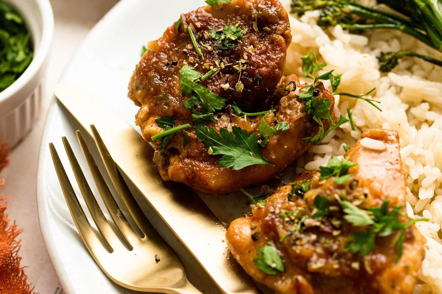 Slow Cooker Chicken Teriyaki Freezer Meal Recipe Close Up of a Plate of Teriyaki Chicken Garnished with Parsley