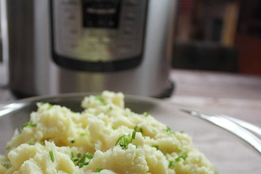 Instant Pot Quotes Close Up of a Bowl of Mashed Potatoes with an Instant Pot in the Background