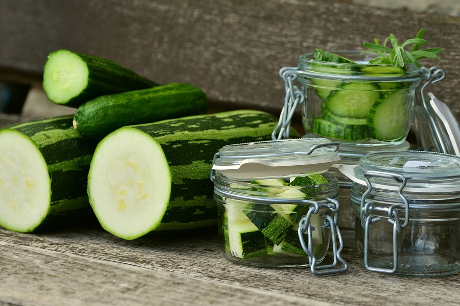 Best Crockpot Zucchini Recipes Close Up of Zucchinis and Zucchini Slices in Glass Jars
