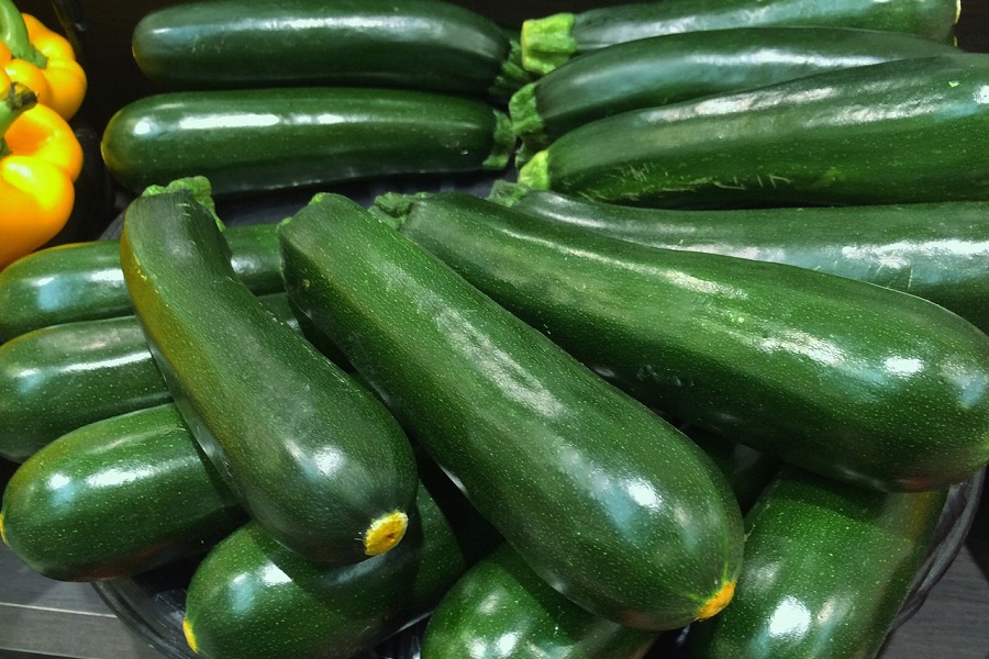 Best Crockpot Zucchini Recipes Close Up of a Bunch of Zucchinis in a Grocery Store