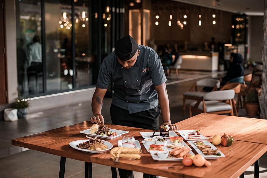 Instant Pot Copycat Recipes View of a Waiter Clearing a Table at a Restaurant