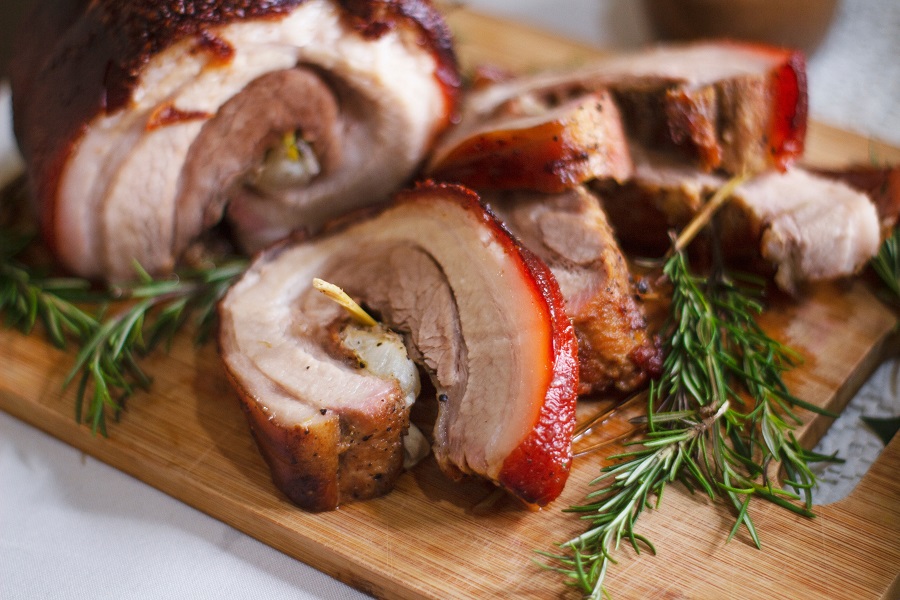 Easy Pork Loin Recipes for the Slow Cooker Pork Loin on a Cutting Board with Sprigs of Rosemary