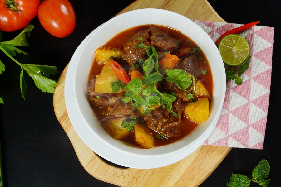 Crockpot Stews with Beef Overhead View of a White Bowl Filled with Beef Stew