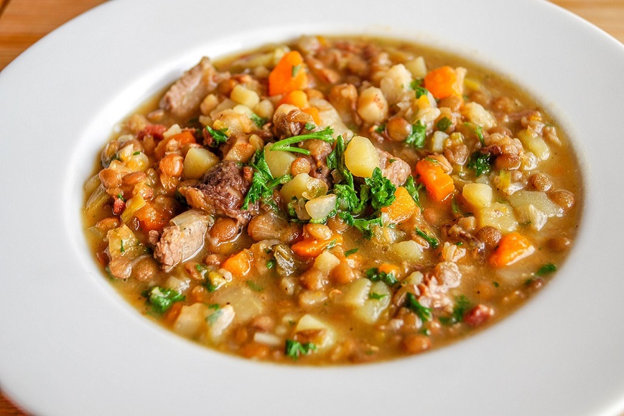 Crockpot Stews with Beef a White Bowl of Beef Stew with Chickpeas and Carrots