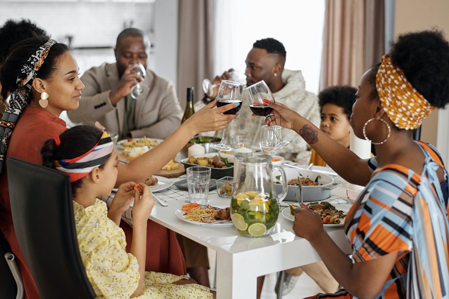 Best Crockpot Thanksgiving Sides a Family Eating Thanksgiving Dinner at a Table