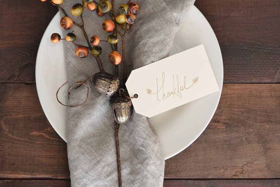 Best Crockpot Thanksgiving Sides Close Up of a Napkin with a Card That Says Thankful