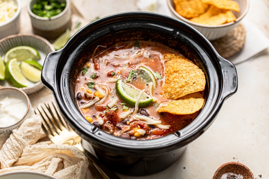 Funny Slow Cooker Memes Overhead View of a Crockpot with Tortilla Chicken Soup Cooking Inside