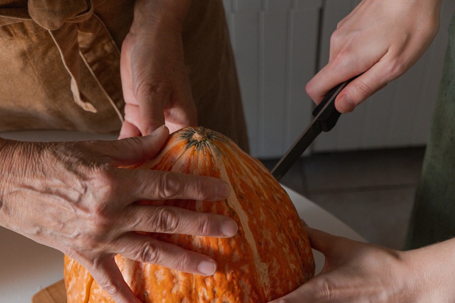 Instant Pot Pumpkin Recipes Two People Cutting a Pumpkin for a Recipe