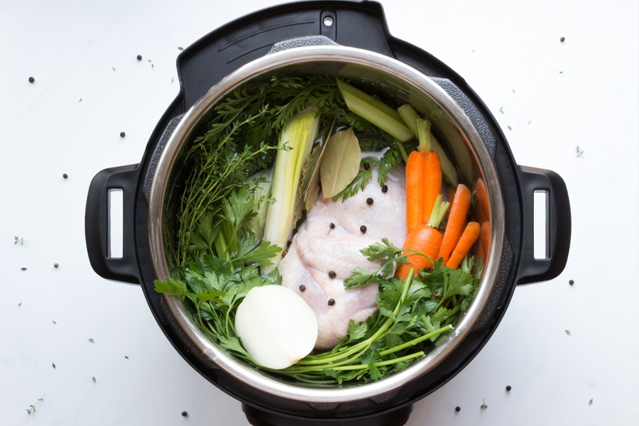 Actual Pressure Cooker Quotes Overhead View of an Instant Pot Filled with chicken and Veggies