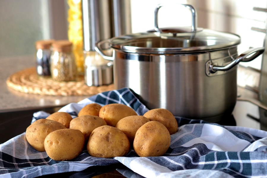 Hashbrown Hamburger Casserole Recipes Potatoes On a Towel Next to a Stew Pot on a Stove