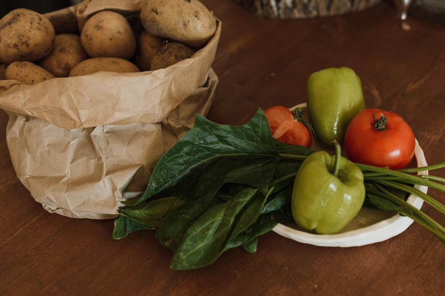 Hashbrown Hamburger Casserole Recipes a Sack of Potatoes Next to a Plate of Veggies and Herbs